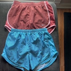 Two pairs of Nike running shorts
